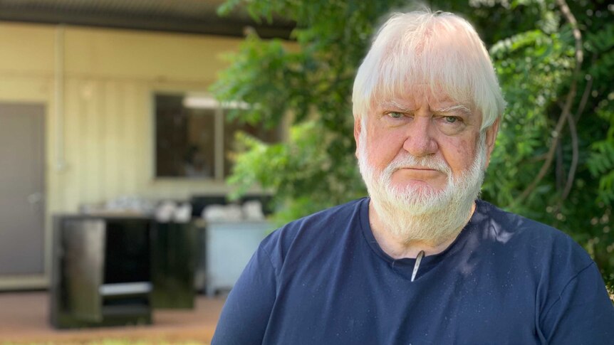 a man with white hair and beard.