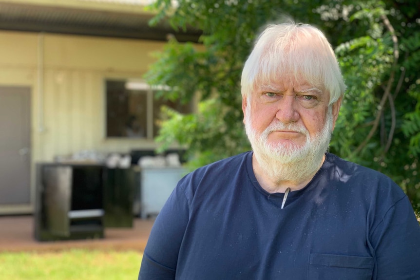 a man with white hair and beard.