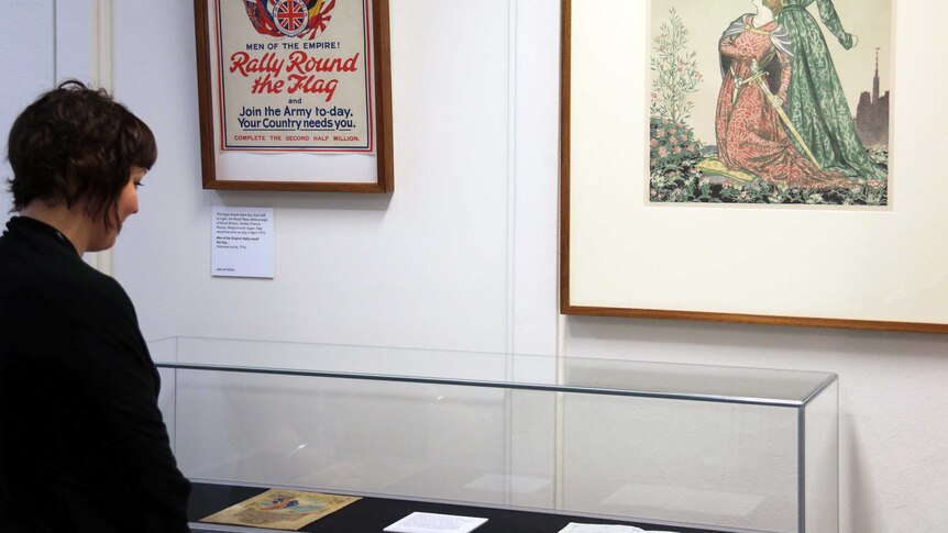 A tourist views the 'Crisis 1914! The call to arms' exhibition at the Museum of Democracy in Old Parliament House.