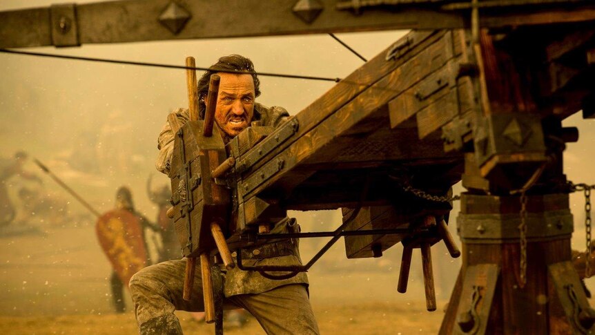 Bronn prepares to fire a ballista in a still image from HBO's Game of Thrones