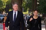 Robert Hughes arrives at London court