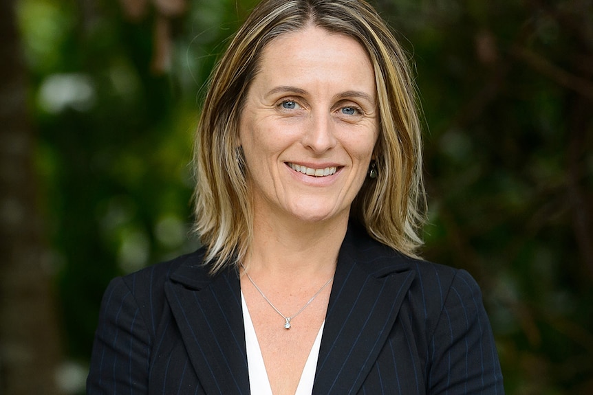 A headshot of a woman smiling 