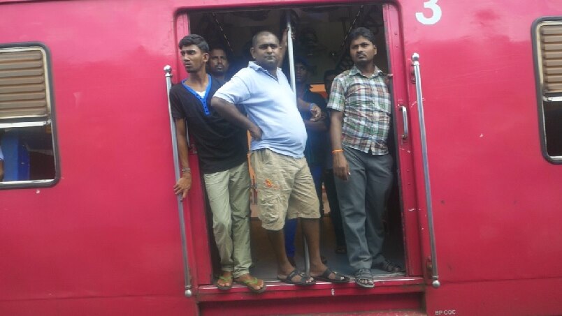 Passengers aboard a train travelling between from Colombo and Jaffna