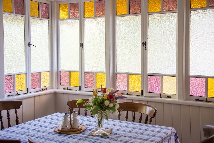 The stained textured windows in the courtyard kitchen.