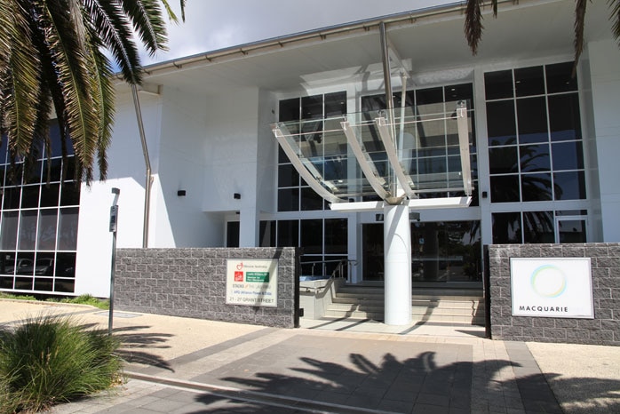 The exterior of a university campus building on a sunny day