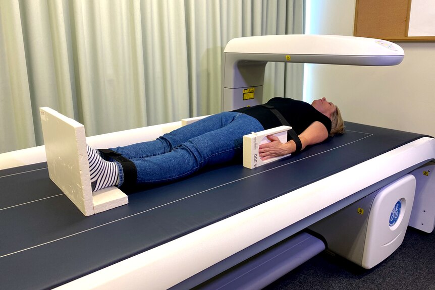 woman lying on body scan bed 