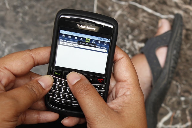 A woman surfs the internet through her Blackberry in Jakarta