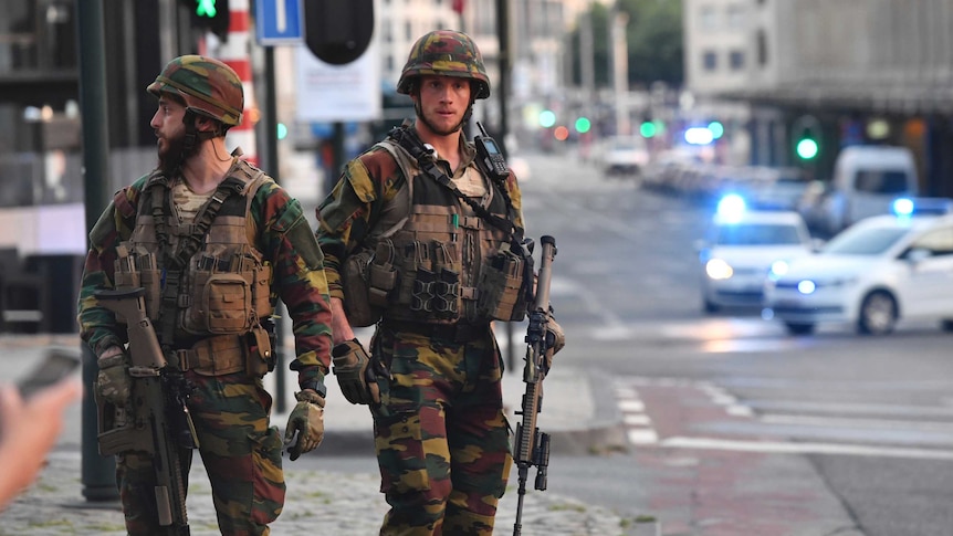 Belgian Army soldiers patrol outside Central Station after a reported explosion in Brussels on June 20, 2017.