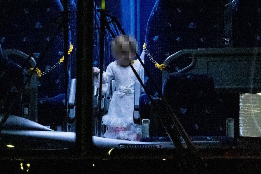 An Afghan child evacuee on a bus in Adelaide.