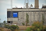 Close up view of AGL signage and Torrens Island power station.