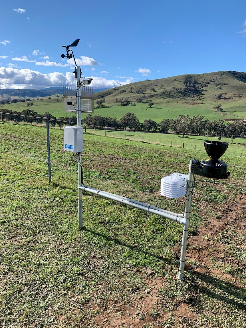 A picture showing various pieces of weather monitoring technology mounted on a metal frame. 