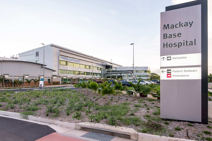 Mackay Base Hospital from the outside with the sign into car park. 