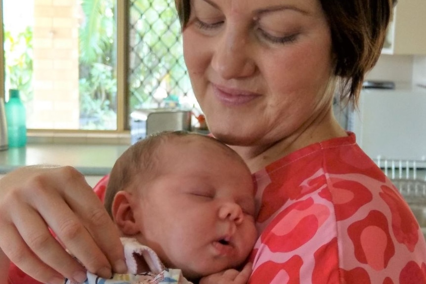 Stacey Hughes holds her baby girl Andi.