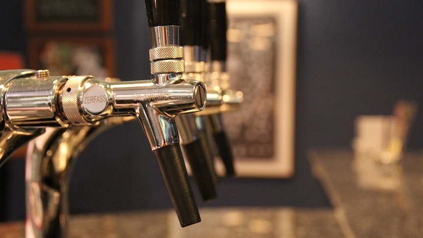 Beer taps at a bar.