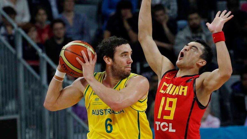 Dominant win ... Australia's Adam Gibson looks to shoot around China's Mugedaer Xirelijiang.