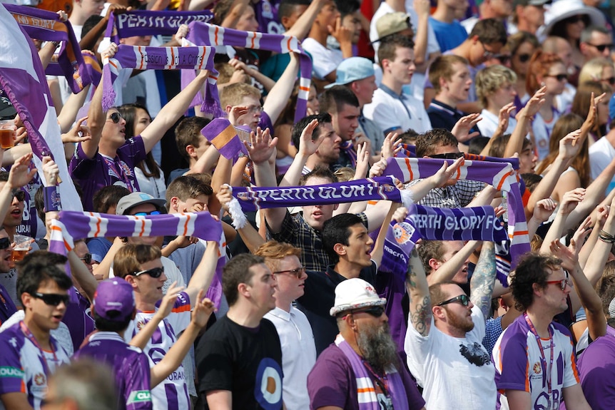 Perth Glory fans chant in the stands