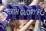 Perth Glory fans chant in the stands