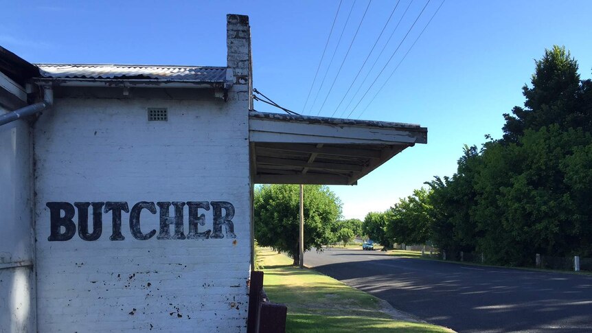 An old building in Bendemeer, NSW,  with a faded 'butcher' painted on the side wall