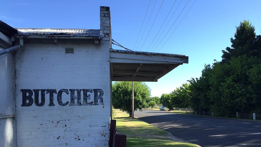 An old building in Bendemeer, NSW,  with a faded 'butcher' painted on the side wall