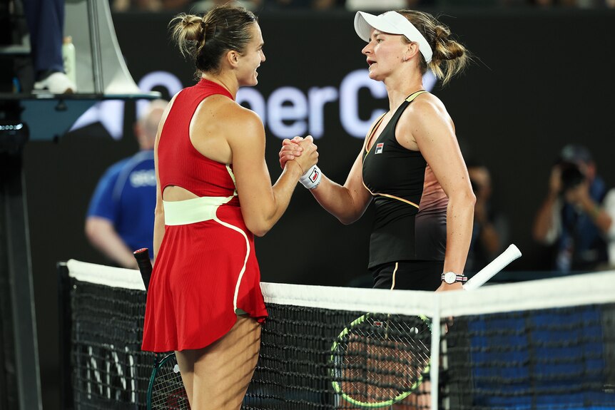  Aryna Sabalenka (L) and Barbora Krejcikova shake hands after their Australian Open match. 