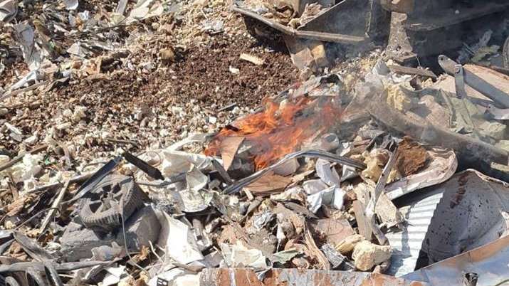 A fire among scrap metal.