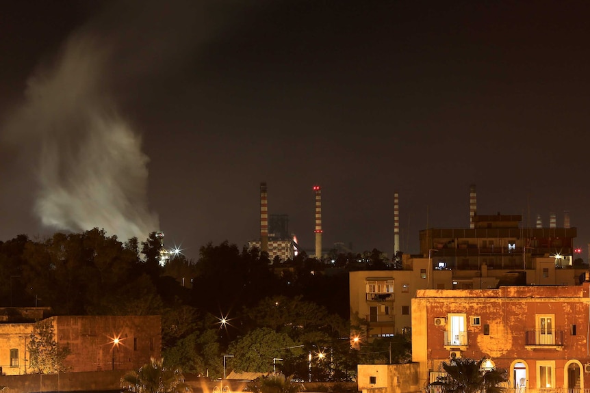 The Ilva steel plant is seen next to the Tamburi district, Taranto.