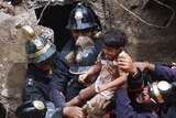 Emergency workers rescue girl from collapsed building in Mumbai