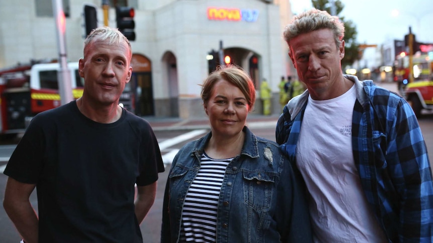 Nathan Morris, Natalie Locke and Shaun McManus standing in row outside Nova's headquarters.