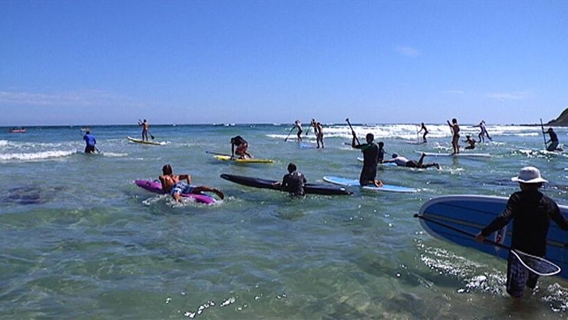 Competitors in the 2010 Australia day charity paddle enter the water
