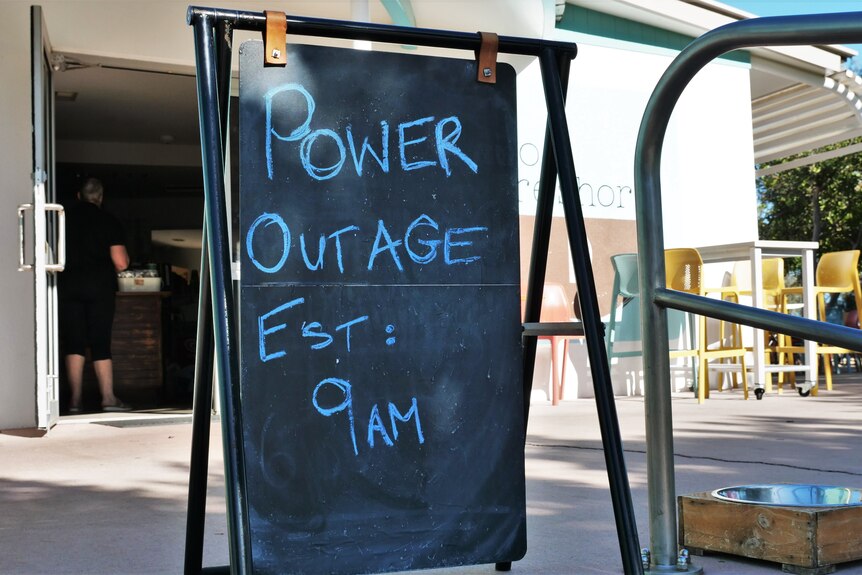 A chalkboard sign outside a coffee shop. 