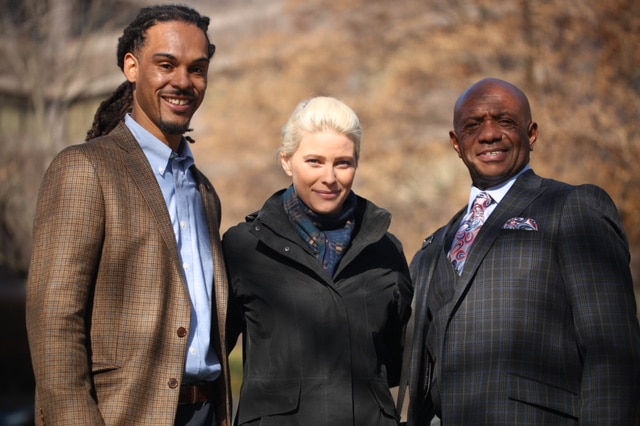 March standing between Winston and McFadden with all three smiling at the camera.