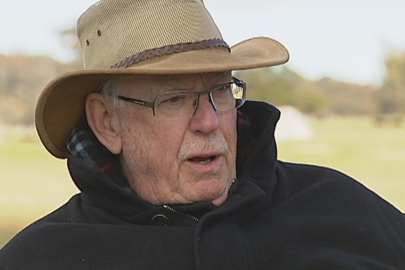 Local cattle farmer Tony Hodgson has threatened to sue neighbours if they put wind turbines on their land.