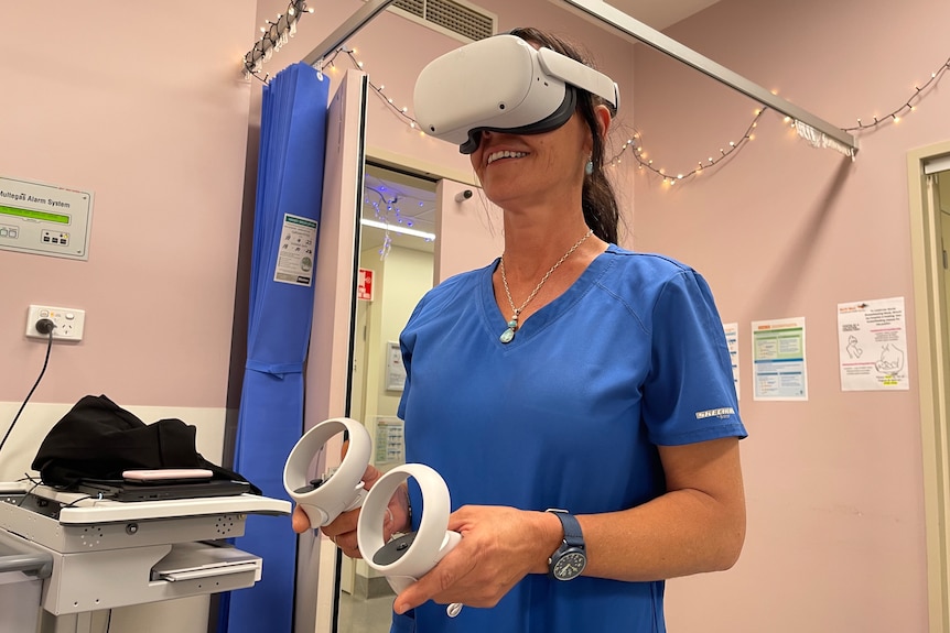 Woman uses virtual reality headset. 