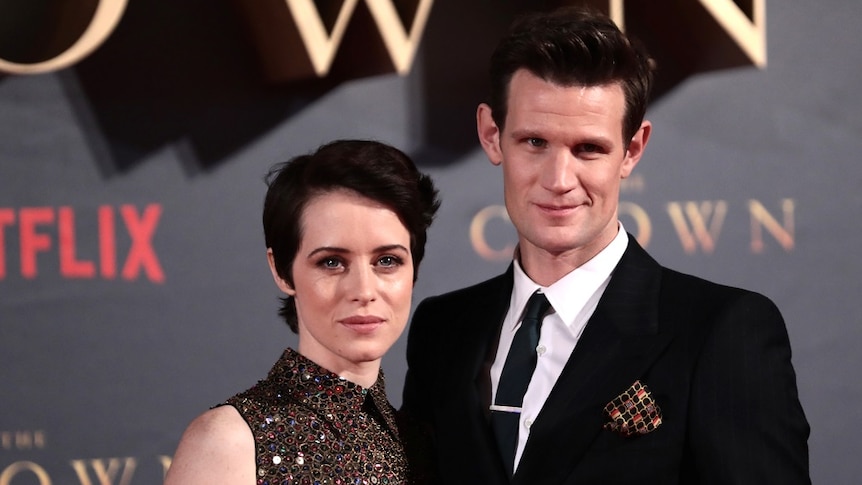 Claire Foy and Matt Smith pose together on the red carpet.