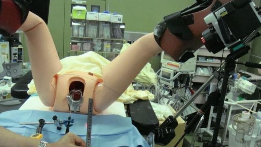 A dummy is used to recreate the surgery.