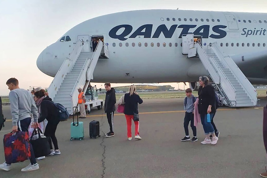Passengers disembarking from a Qantas plane