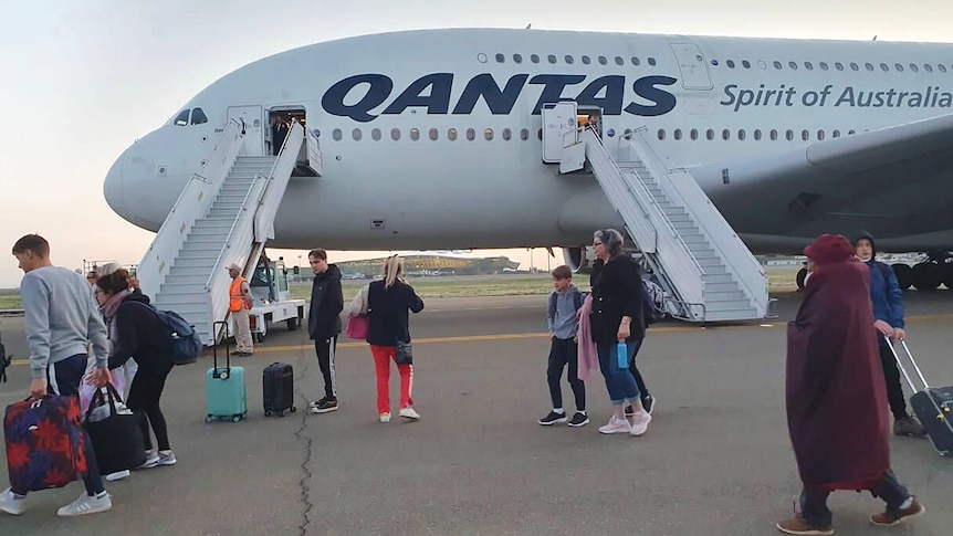 Passengers disembarking from a Qantas plane