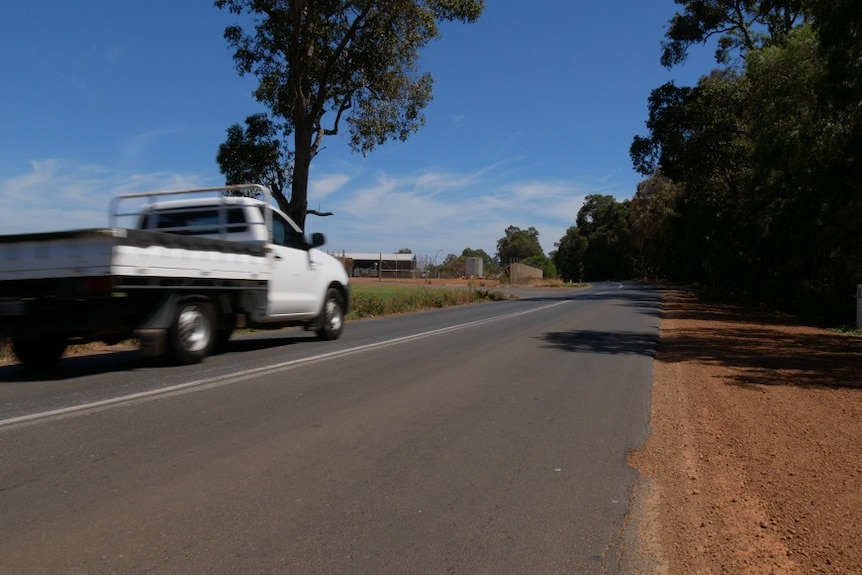 A utility vehicle drives along a narrow single-lane road in WA's South West