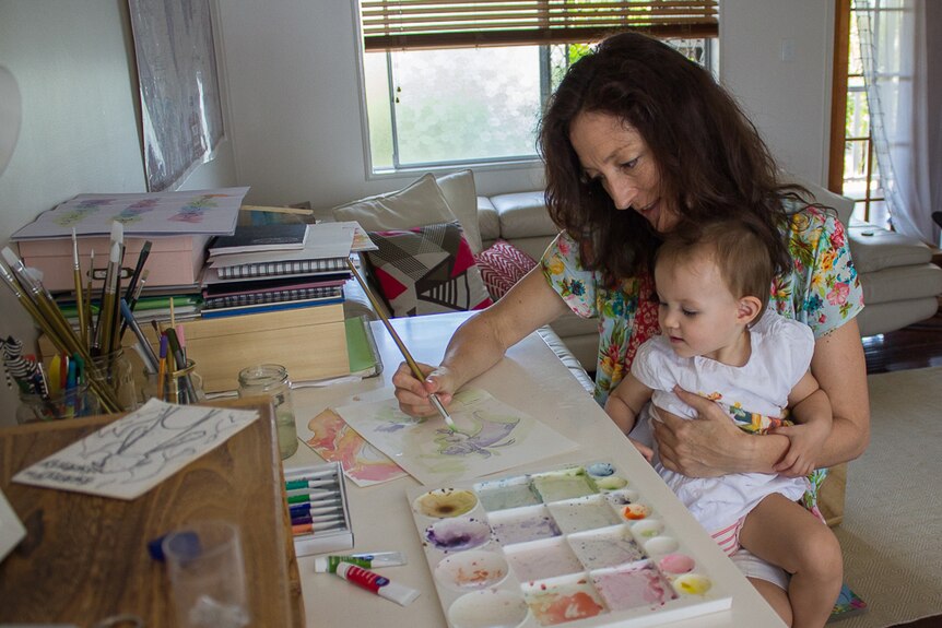 Nathalie Fernbach painting with daughter.