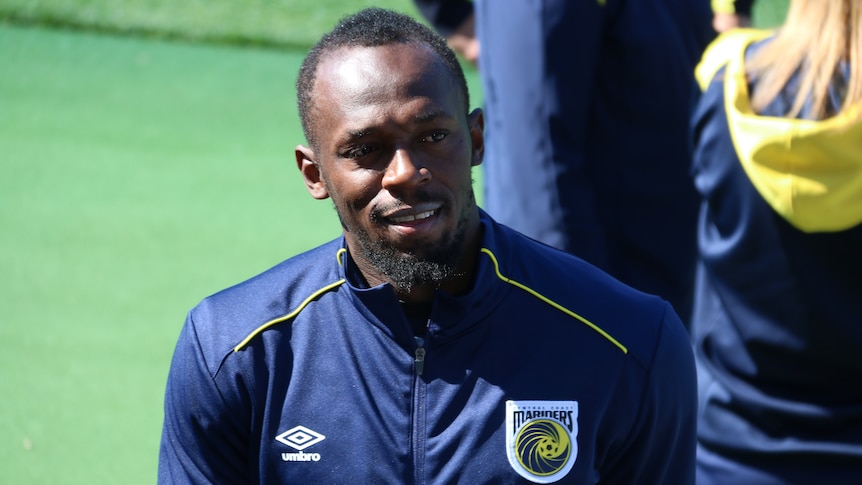 Usain Bolt smiles at his first training session with Central Coast Mariners in Gosford.