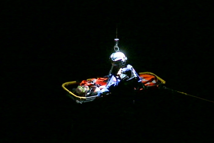 The 18-year-old in a stretcher being rescued.