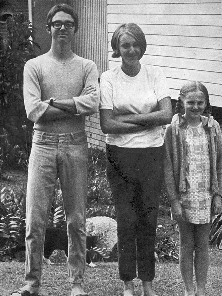 Black and white photo of siblings Mark, Sue-Ellen and Amanda, standing next to each other