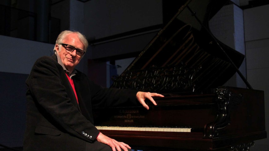 Pianist Gerard Willems poses with the Bechstein Piano displayed at the 1879 Sydney International Exhibition.