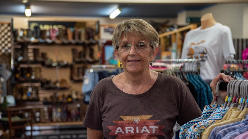 Julie Newton stands in her store on the main street of Katherine. 