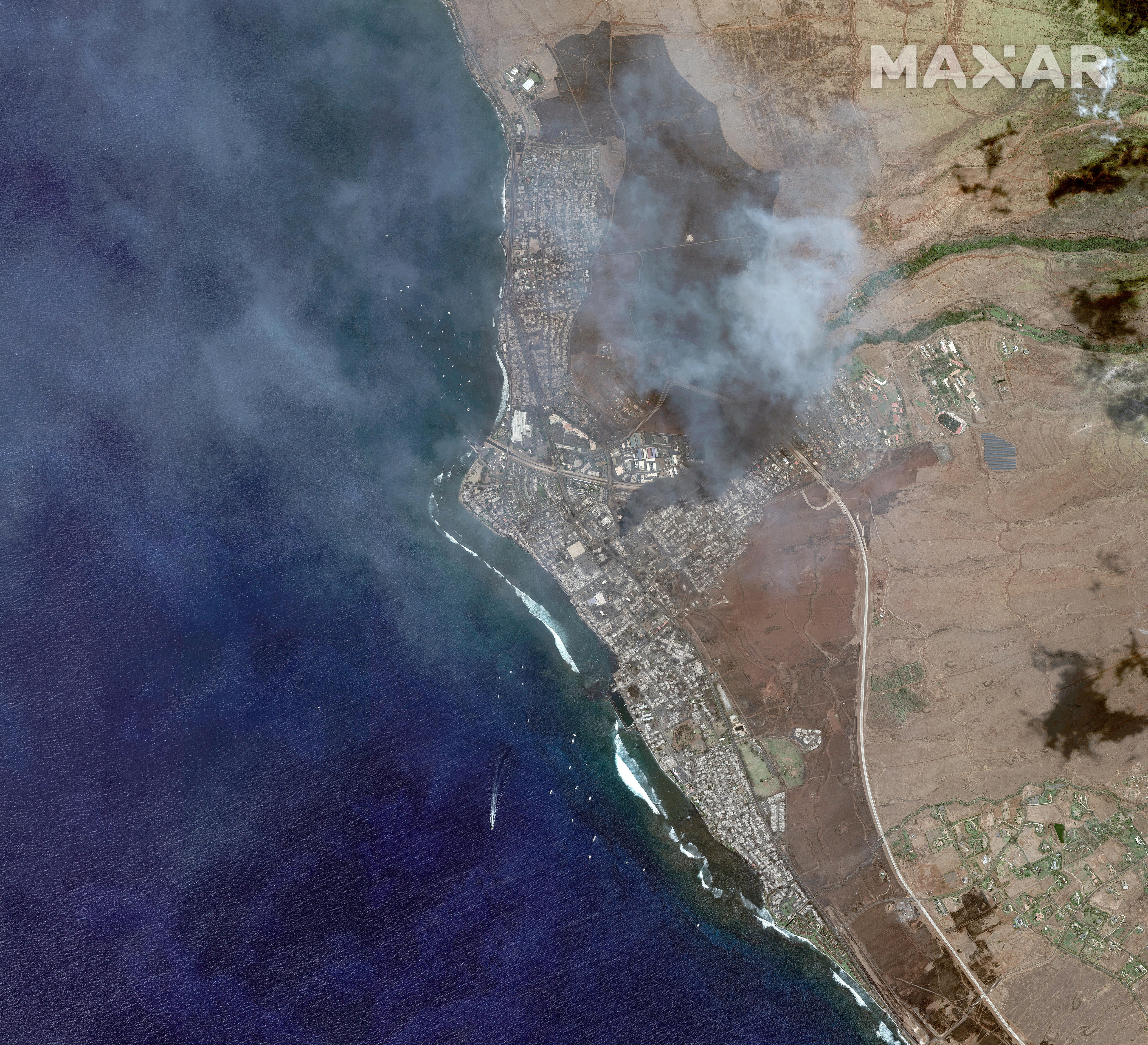 Images taken on June 25 and August 9 of the same area following a wildfire that tore through the area. (Maxar Technologies)