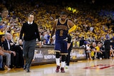 Injured Kyrie Irving of the Cleveland Cavaliers leaves game one of NBA Finals against Golden State.
