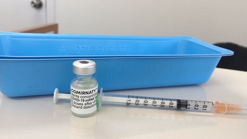 A bottle of vaccine and a needle