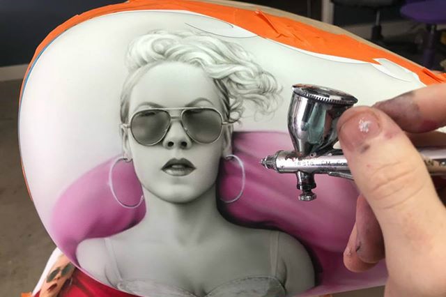 Airbrush painting of music artist Pink on a Harley tank