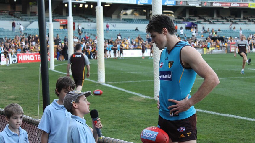 Clay Gibsone interviews Isaac Smith during a training session at Subiaco Oval, 16 August 2014.