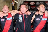 James Hird celebrates win against Carlton with players
